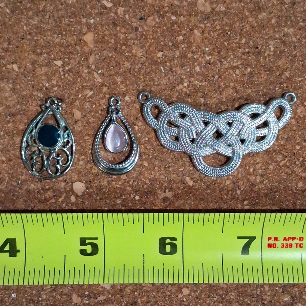 Lot of three cute silvertone necklace charms.